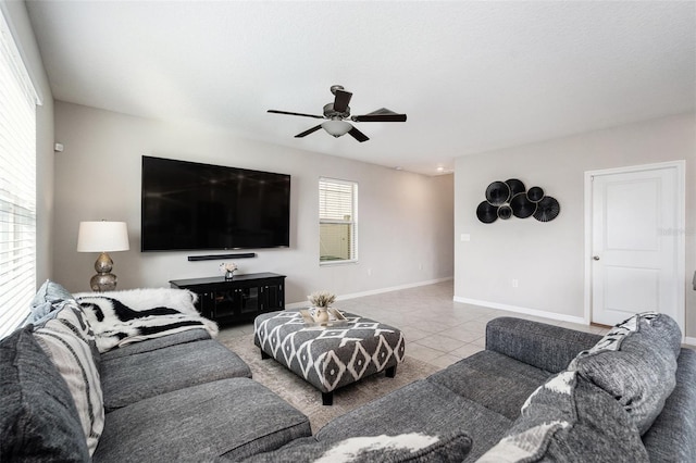 living room with ceiling fan and tile patterned floors