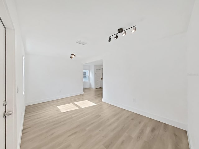 spare room featuring light hardwood / wood-style flooring