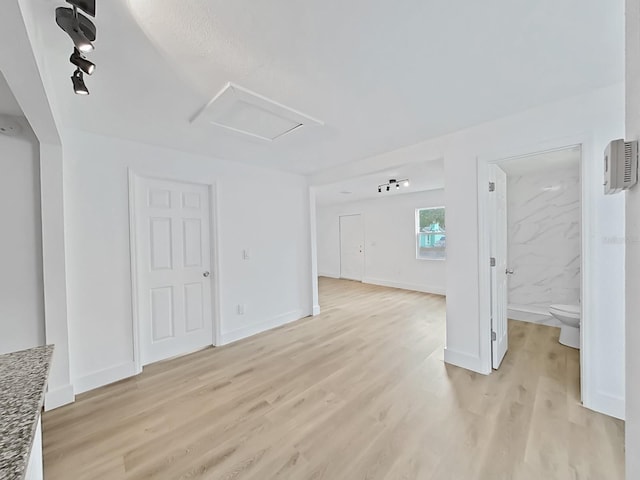 unfurnished living room with light wood-type flooring