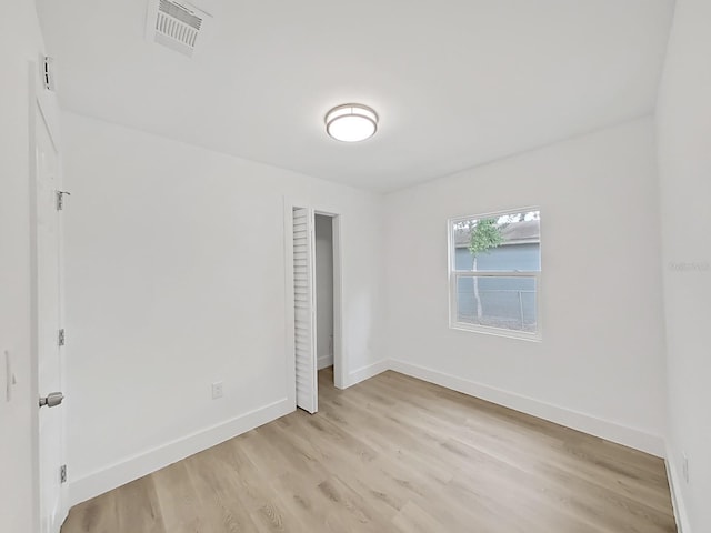 empty room with light wood-type flooring