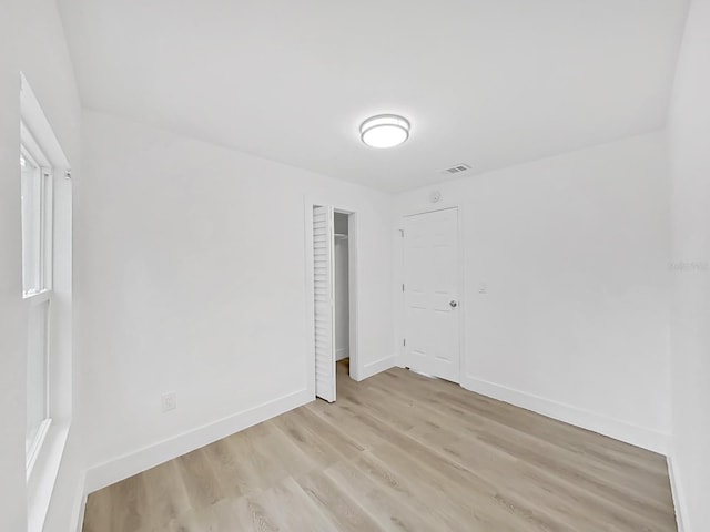 spare room with light wood-type flooring