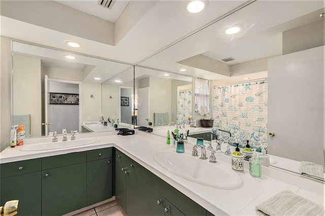 bathroom with tile patterned floors and vanity