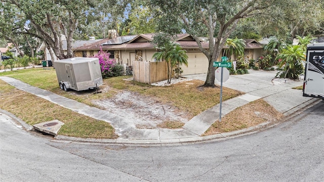 view of front of home featuring a front yard and solar panels