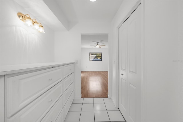 hallway with light hardwood / wood-style flooring