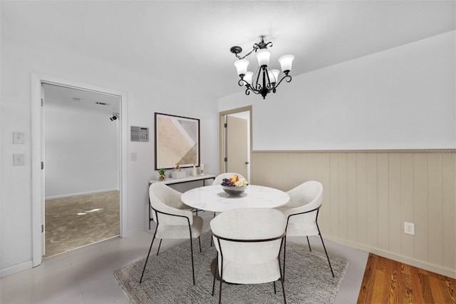 dining area featuring a notable chandelier