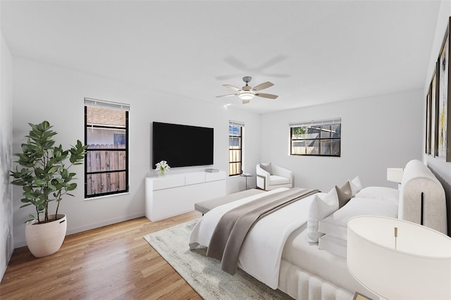 bedroom featuring light hardwood / wood-style floors and ceiling fan