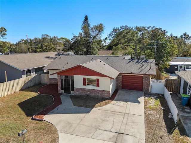 ranch-style home featuring a garage and a front yard