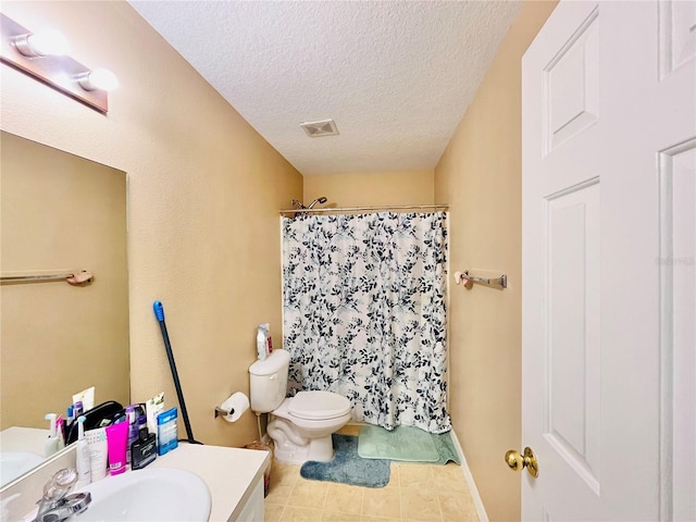 bathroom featuring curtained shower, a textured ceiling, toilet, and vanity