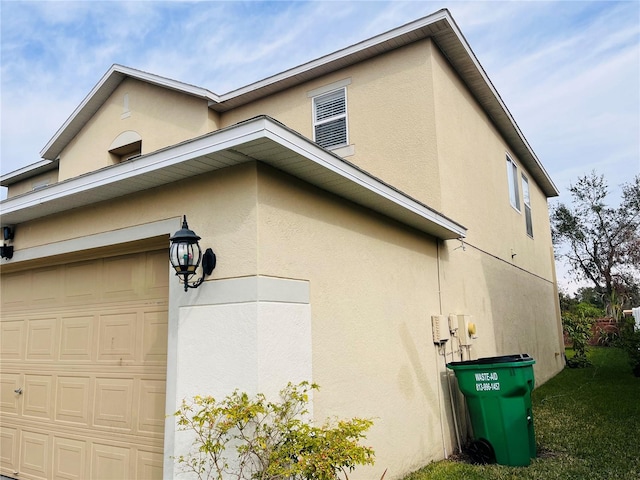 view of property exterior with a garage