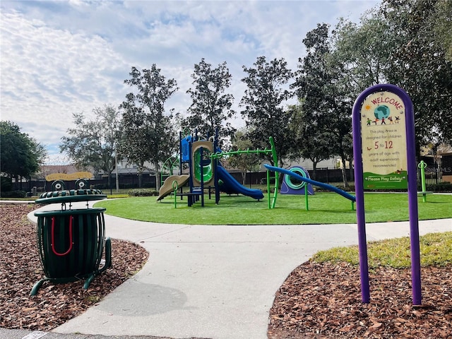 view of jungle gym with a lawn