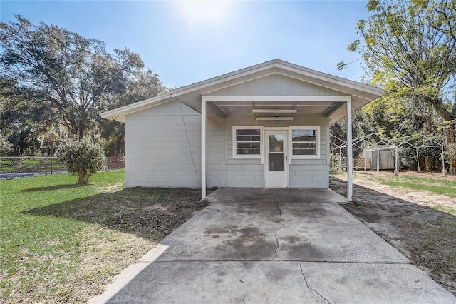 exterior space with a front yard and a storage shed