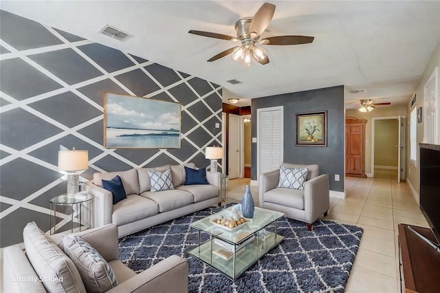 tiled living room with ceiling fan