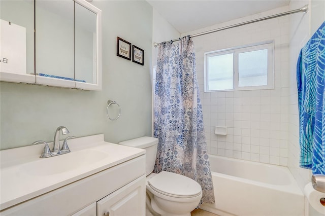 full bathroom featuring vanity, toilet, and shower / tub combo with curtain