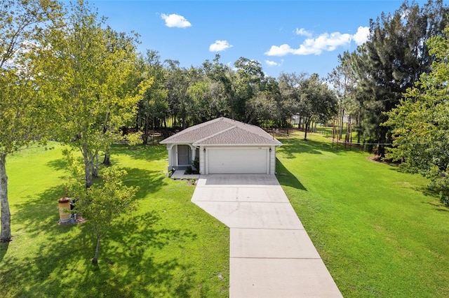 view of front of house featuring a front yard and a garage