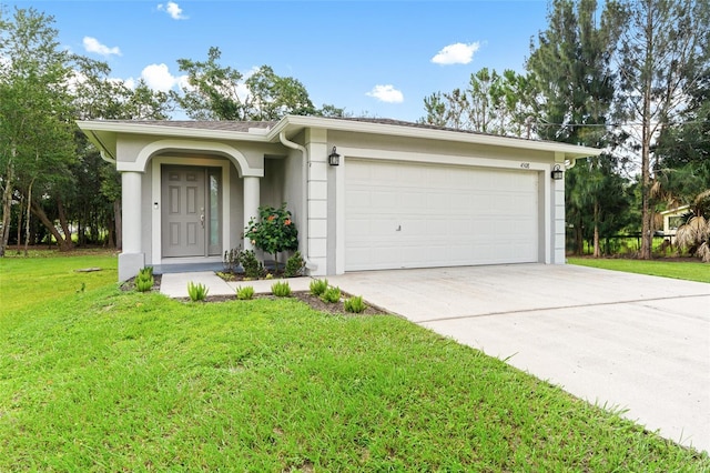 ranch-style home with a front lawn and a garage