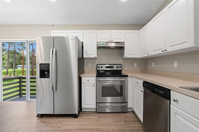 kitchen with light hardwood / wood-style floors, white cabinetry, and stainless steel appliances