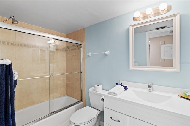 full bathroom featuring vanity, bath / shower combo with glass door, and toilet