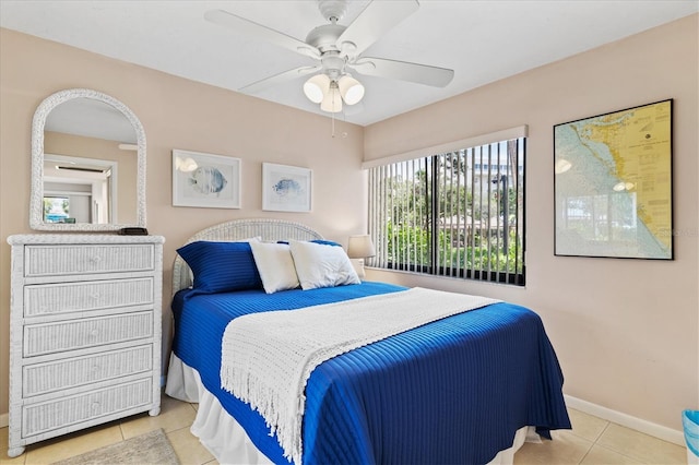 tiled bedroom with ceiling fan