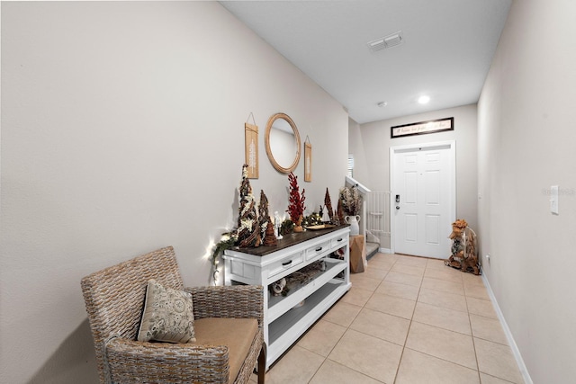 foyer featuring light tile patterned floors