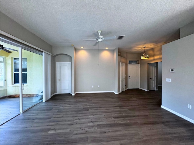 spare room featuring a textured ceiling, dark hardwood / wood-style floors, and ceiling fan