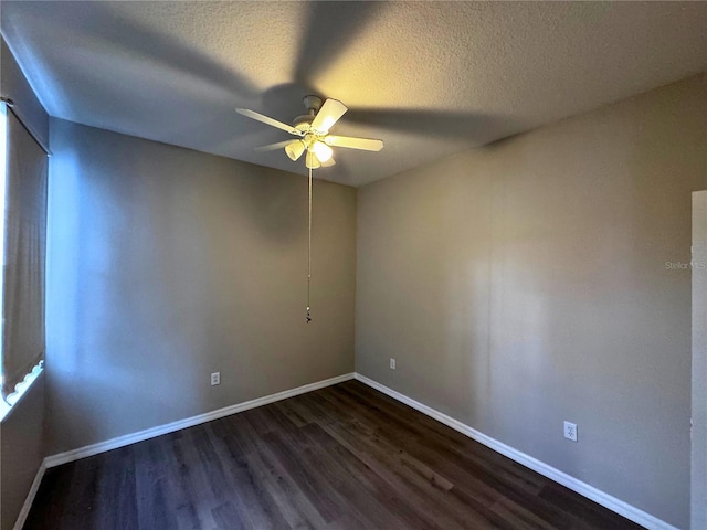 unfurnished room featuring ceiling fan, a textured ceiling, and dark hardwood / wood-style flooring