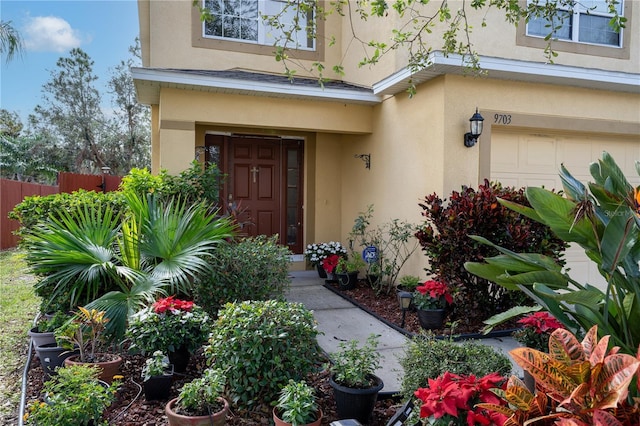 view of exterior entry featuring a garage