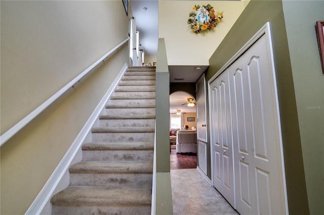 stairway with ceiling fan