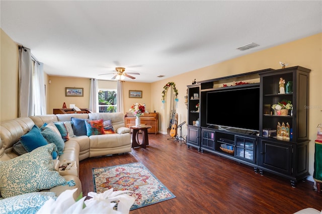 living room featuring dark hardwood / wood-style floors and ceiling fan