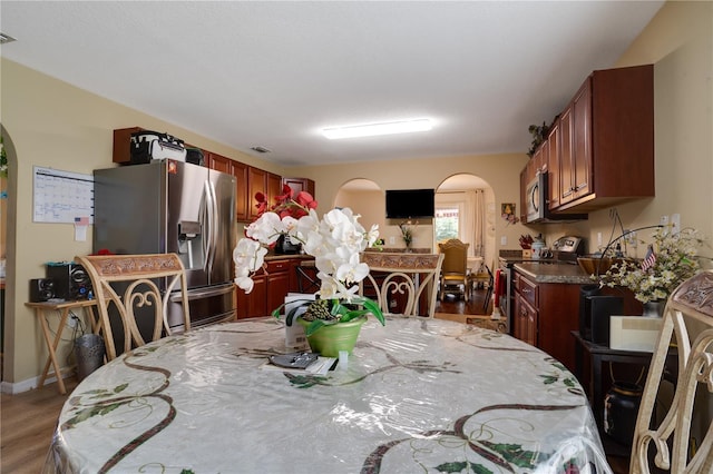 dining area featuring hardwood / wood-style flooring