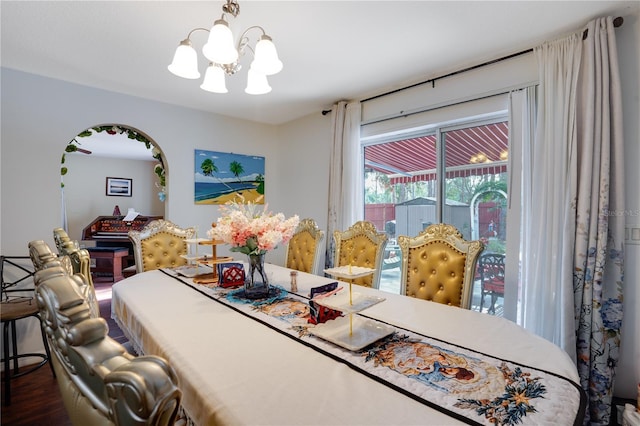 dining room with a chandelier and dark wood-type flooring