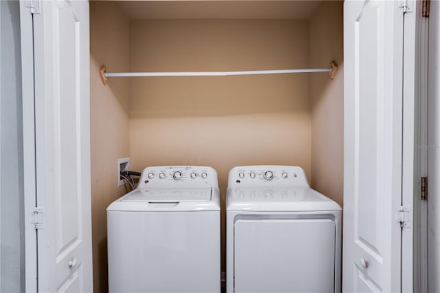 laundry room featuring separate washer and dryer