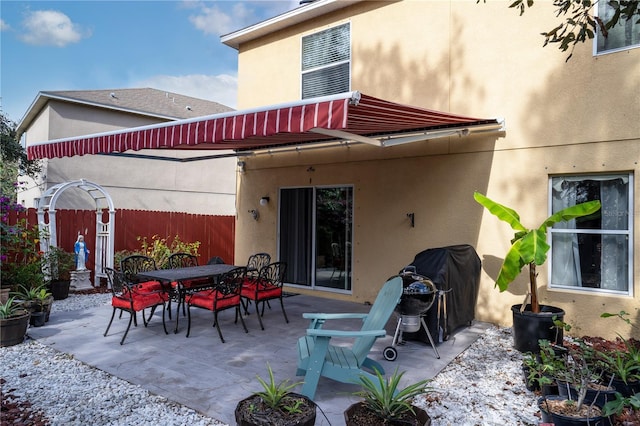 rear view of property featuring a patio