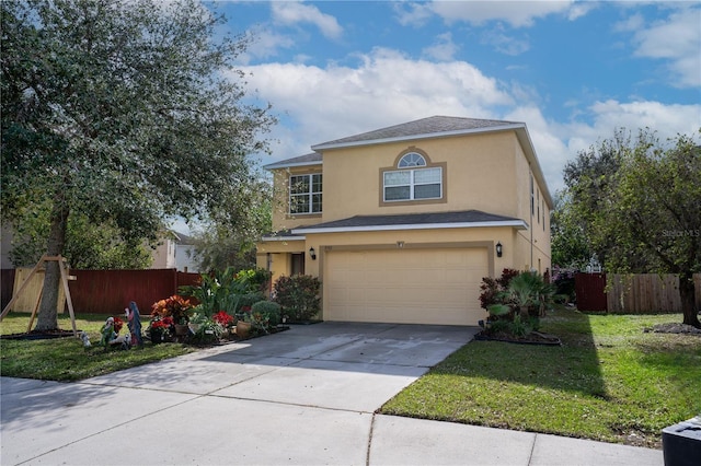 view of front of house with a garage and a front yard