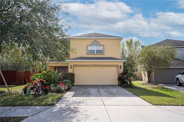 view of front of property featuring a garage and a front lawn