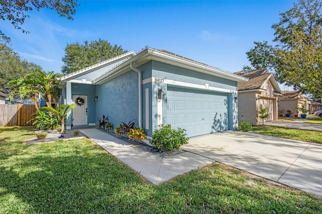 view of front of house featuring a front lawn and a garage