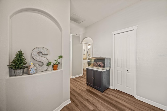 corridor featuring dark wood-type flooring