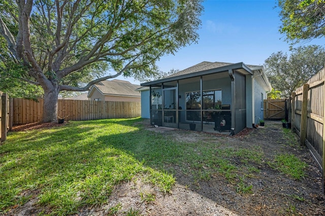 view of yard with a sunroom