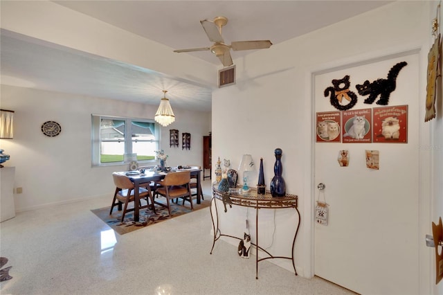 dining room featuring ceiling fan with notable chandelier