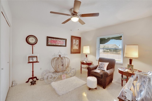 sitting room featuring ceiling fan