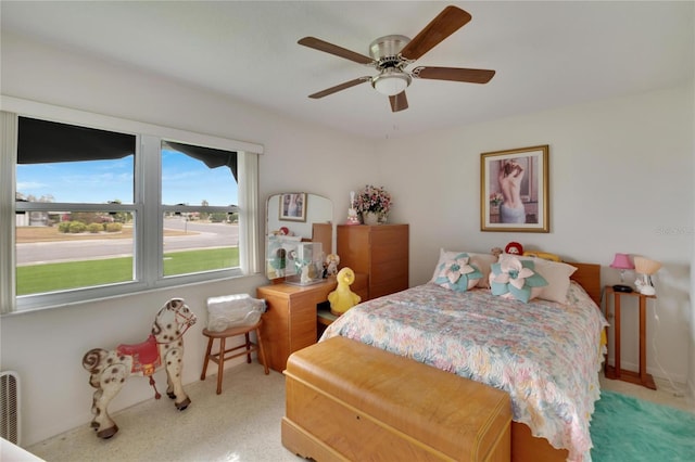 bedroom featuring light carpet and ceiling fan