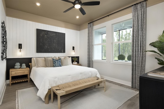 17390 Moonflower Dr Unit 102, Venice, FL 34293 - bedroom with a ceiling fan, recessed lighting, baseboards, and wood finished floors