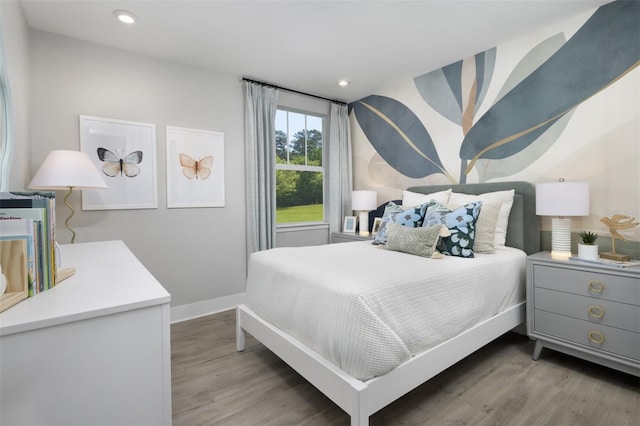 17390 Moonflower Dr Unit 102, Venice, FL 34293 - bedroom with recessed lighting, baseboards, and wood finished floors