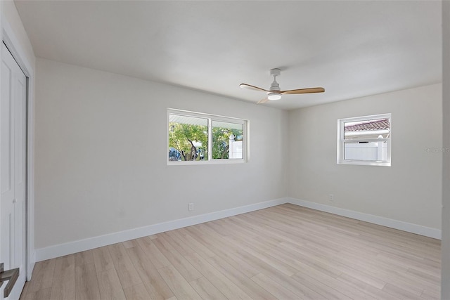 spare room featuring light hardwood / wood-style floors and ceiling fan