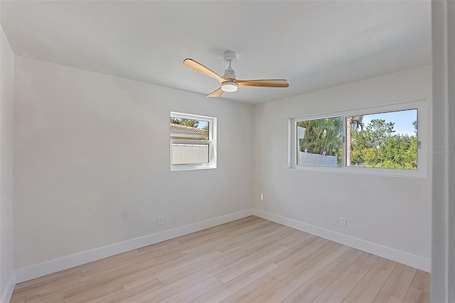 unfurnished room with ceiling fan and light hardwood / wood-style flooring