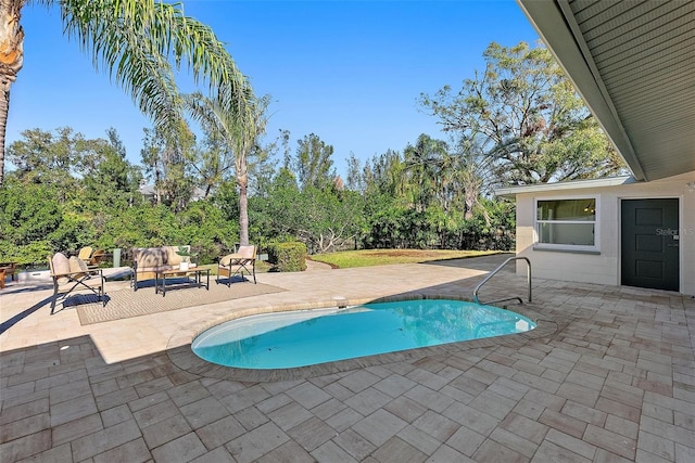 view of pool with an outdoor hangout area and a patio