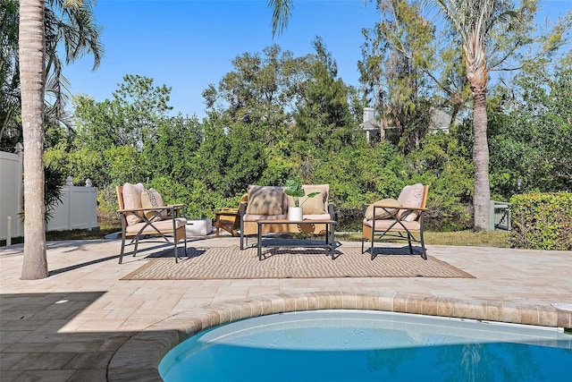 view of pool featuring outdoor lounge area and a patio area