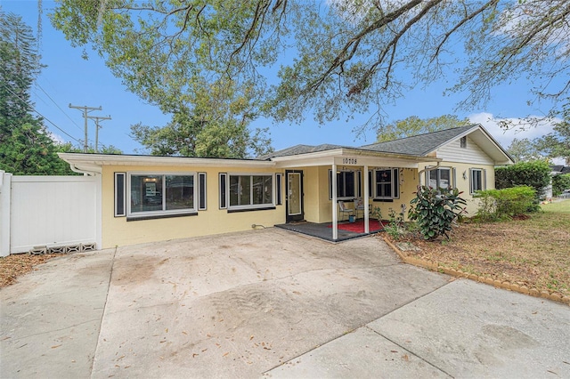 single story home with fence