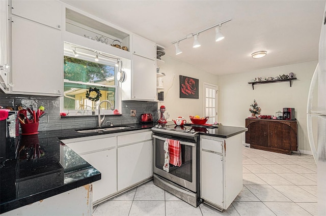 kitchen with white cabinetry, sink, electric range, backsplash, and light tile patterned floors