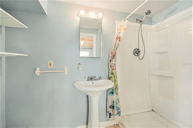 bathroom featuring curtained shower