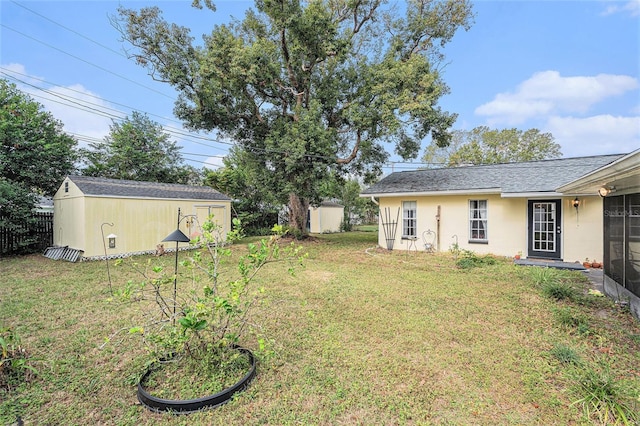 view of yard featuring a storage unit